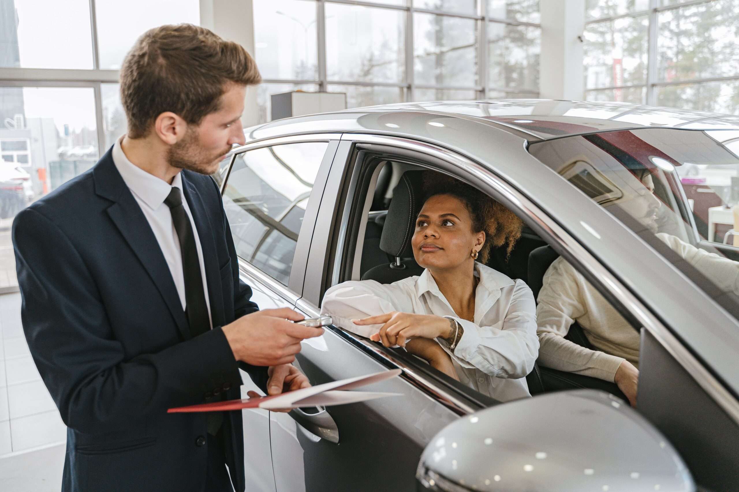 husband gave away car story showing a woman receiving keys to a new car